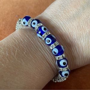 “Evil Eye” with rhinestones silver tone bracelet.